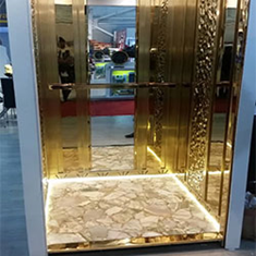 کابین-آسانسور-با-تزئین-استیل-طلایی